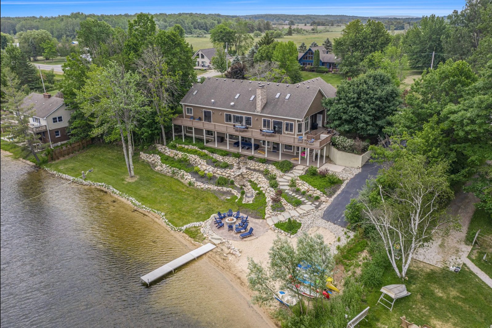 Lakefront vacation home with dock, beach, and fire pit